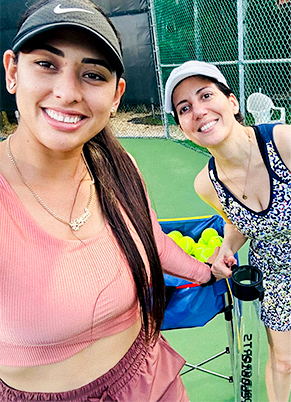 tennis coach with students
