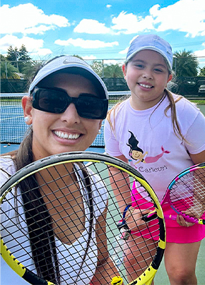 tennis coach with students