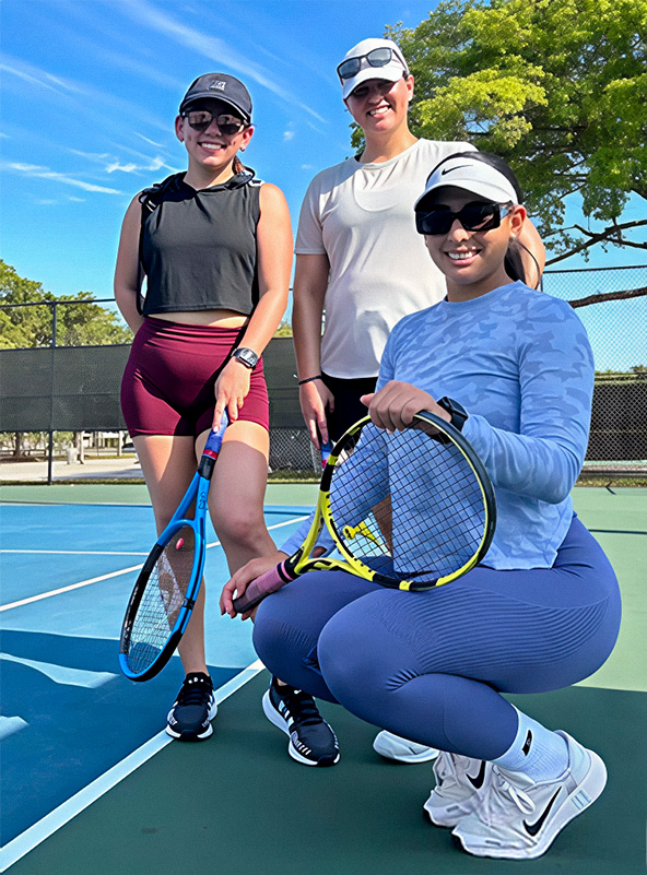tennis coach with students