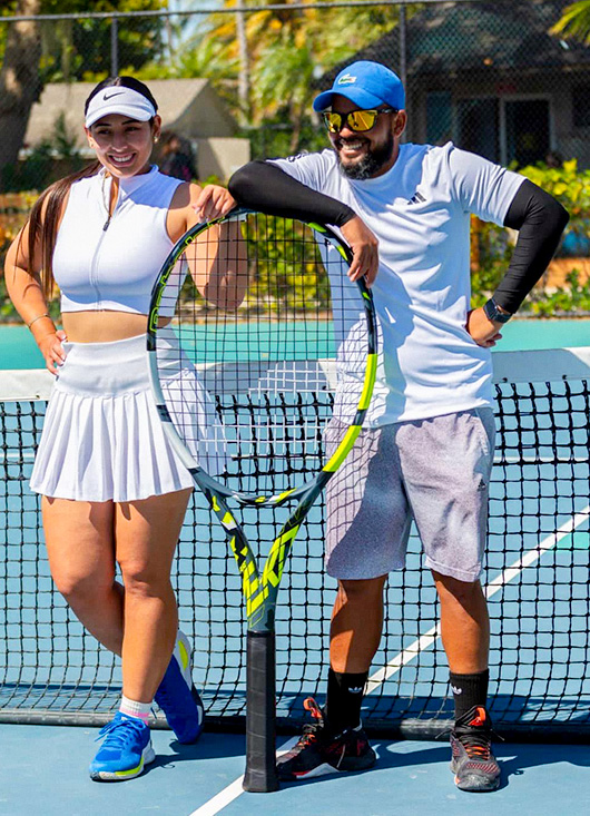 tennis coach with students